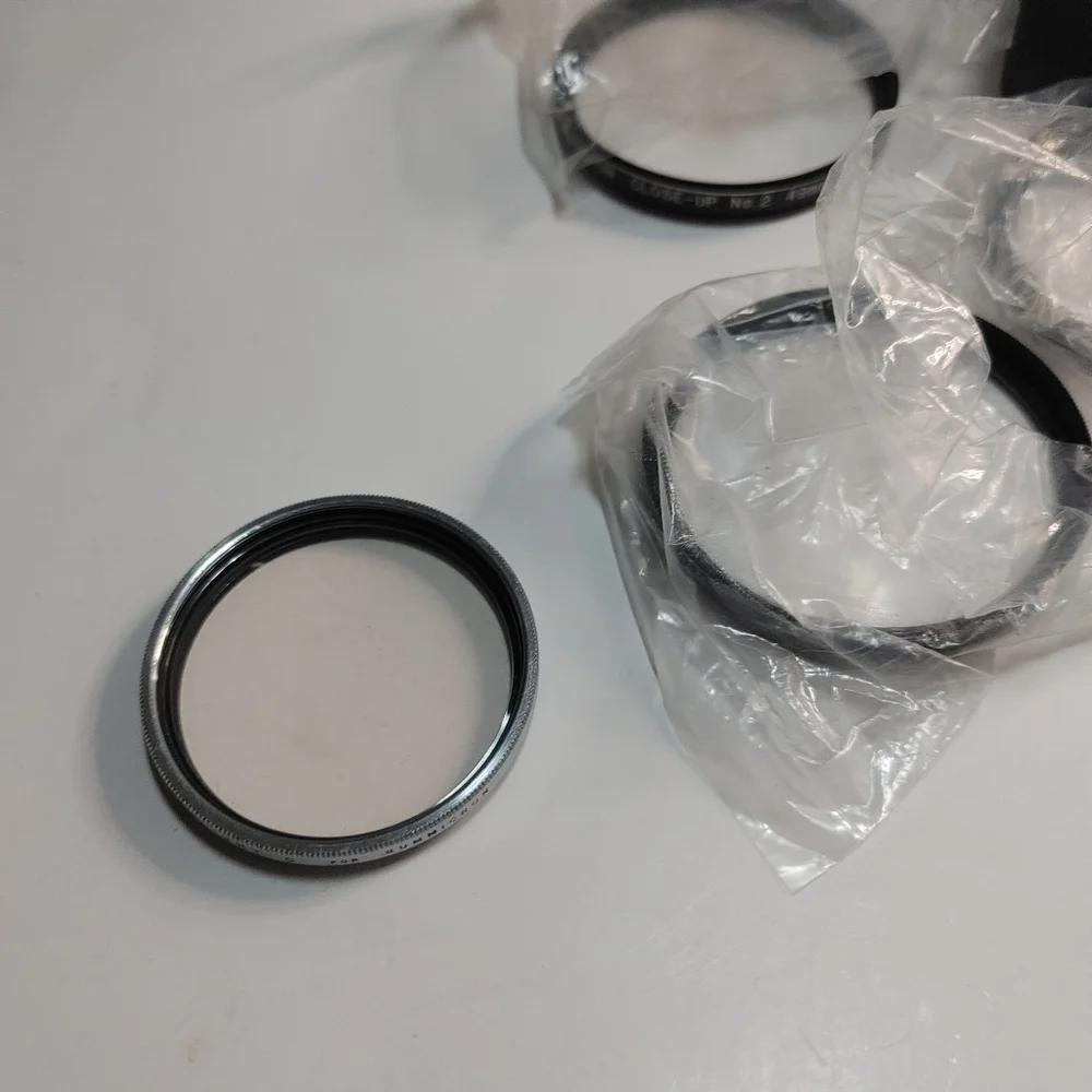 wholesale Lot of 12 - various size camera Lenses & Adapters Very Good Conditio